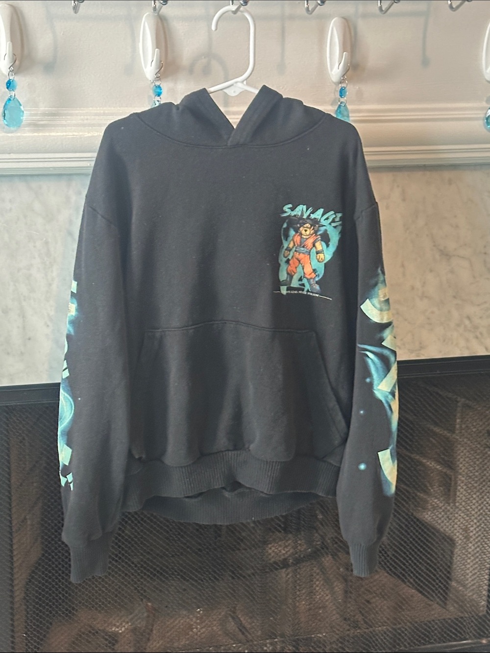 Savage Graphic Black Kids Hoodie with Teal Accents